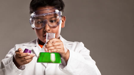 Young Boy Conducting Science Experiment